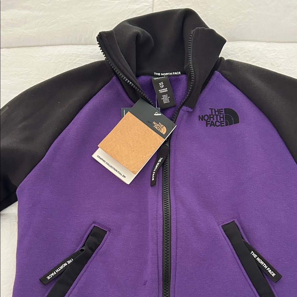 The North Face Black and Purple Fleece Jacket, women xs. Could fit juniors size